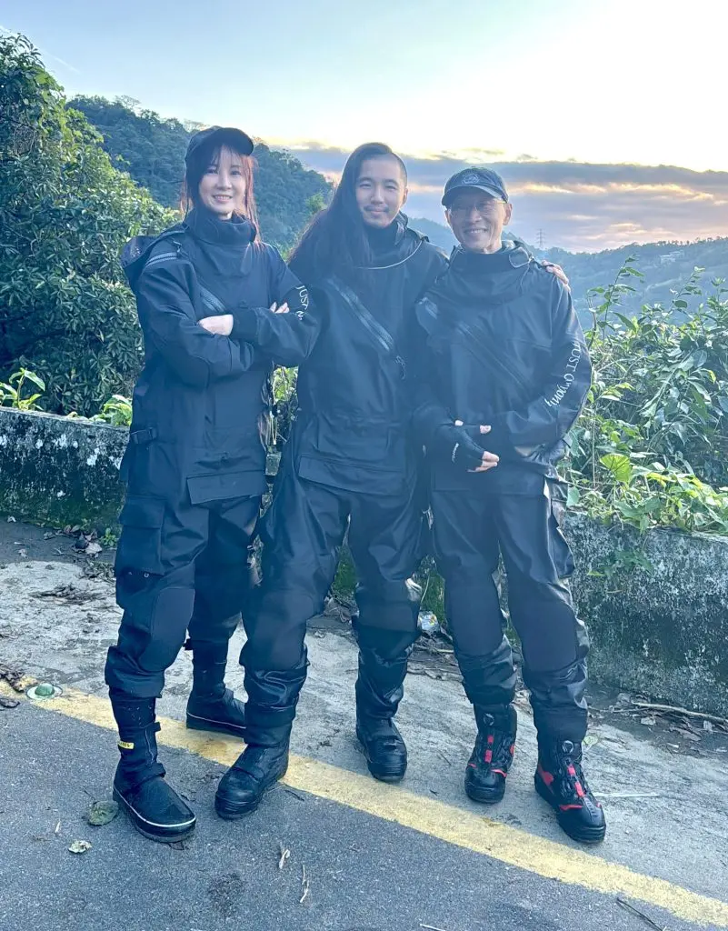three people wearing exclusive dry suits for canyoning from just canyoning