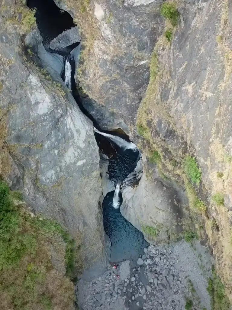 flying dragon waterfall group drone shot from above